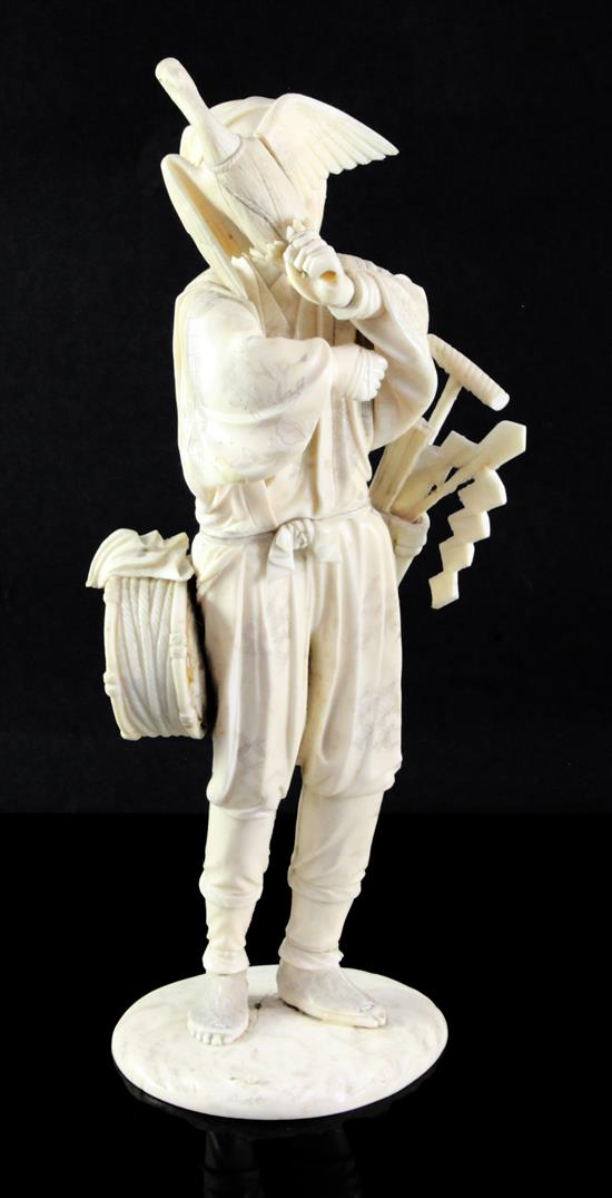 A Japanese sectional ivory figure of a cormorant fisherman, early 20th century, 31.5cm